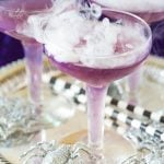 Witch's Brew Halloween Cocktail!This purple sassy Halloween cocktail is too fun and a drop of dry ice makes it even spookier! pizzazzerie.com